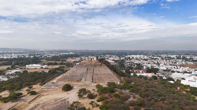 Pyramid of the El Cerrito archaeological site in Queretaro, Mexico. Drone view of the pyramid and the city