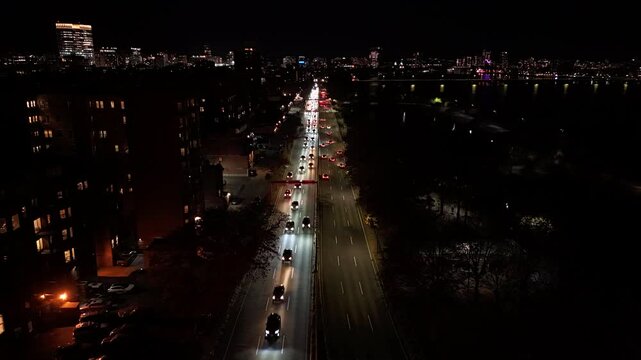 night aerial footage of the downtown city of Boston with buildings with lights