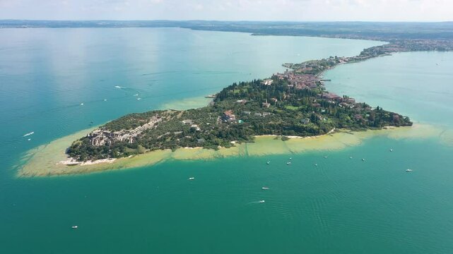 Grotto of Catullus Sirmione Lake of Garda Aerial Drone View. Archaeological site of Grotte di Catullo, Sirmione, Italy early morning aerial view. lake garda.