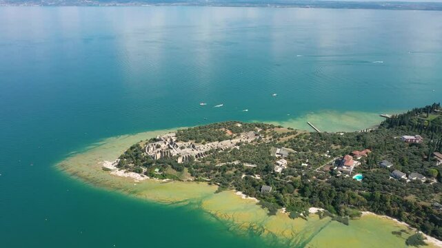 Grotto of Catullus Sirmione Lake of Garda Aerial Drone View. Archaeological site of Grotte di Catullo, Sirmione, Italy early morning aerial view. lake garda.