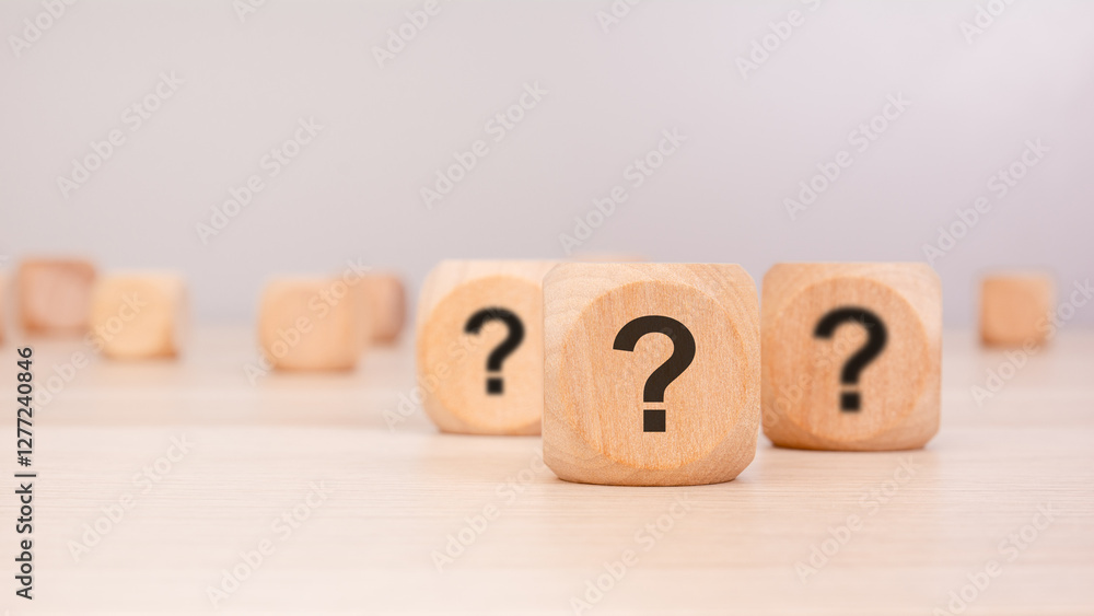 Poster wooden blocks with question marks symbolizing uncertainty, decision-making, problem-solving concepts