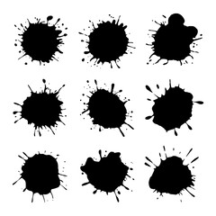 A set of black ink splashes in different sizes and shapes. Expressive blot textures on a white background.