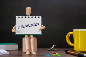 There is notebook with the word Personalization. It is as an eye-catching image.