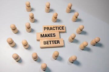 Wooden blocks with words 'Practice Makes Perfect'. Business concept.