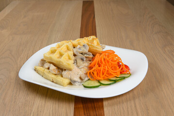 Savory Waffles with Mushroom Sauce and Salad: A delicious and unexpected combination of flavors and textures