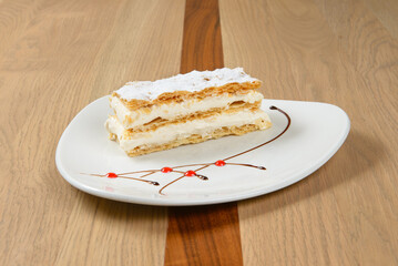 Delicious Cream Slice Pastry: Flaky layers and creamy filling topped with powdered sugar A perfect treat!
