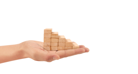 Demonstrating growth hand holding wooden blocks in progression studio setting photography neutral background close-up business concept