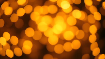 Fototapeta premium Glowing golden bokeh lights for a festive holiday background
