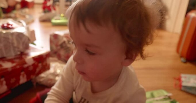 Excited Kid During Christmas Pats the Camera