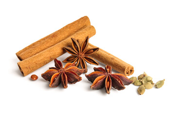 Anise stars with seeds and cinnamon on white background
