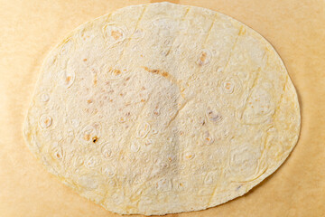 Making tortillas in a traditional kitchen setting