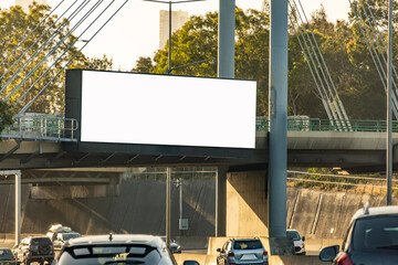 A blank white billboard mounted above a busy multi-lane road, serving as an urban highway advertising space. A background texture with copy space for customizing an outdoor ad mockup.