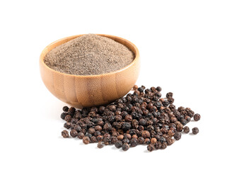 Wooden bowl with black pepper powder and peppercorns on white background