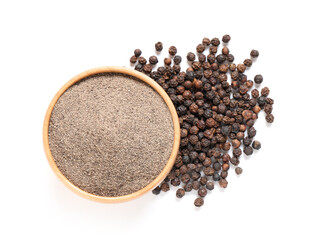 Wooden bowl with black pepper powder and peppercorns on white background