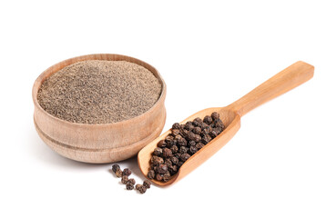 Bowl of black pepper powder and wooden scoop with peppercorns on white background