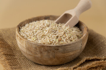 Raw brown rice Gluten free cereals. Health gut benefits. Concept of alternative whole spelt grain ingredient. Vegetarian diet recipes. Plant-based lifestyle. Copy space Protein rich eating 