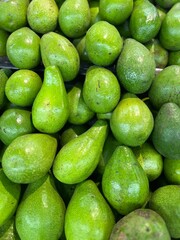 stack of avocado at the market stall