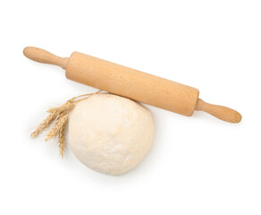 Fresh dough, rolling pin and spikes isolated on white, top view