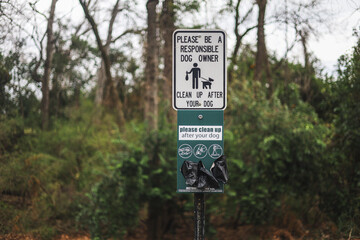 clean up after your dog sign in the park dog pet waste sign