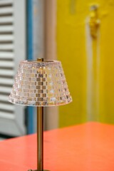 Beautiful table lamp on the table. Ornament or decoration