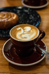 Steaming Elegance: Artisan Coffee Cup in a Modern Café 