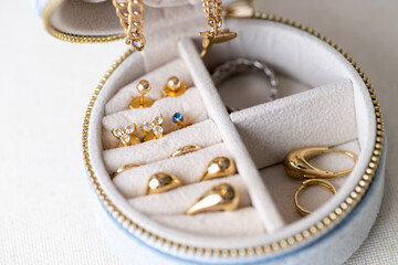 Close up of Travel Jewelry Case with Gold Earrings and Rings