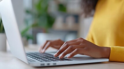 Empowered young woman focused on technology while working at home office
