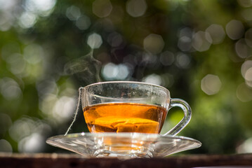 Cups of tea with bokeh on wooden table