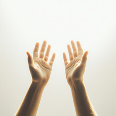 Fototapeta premium Open hands reaching towards the light, symbolizing hope, freedom, and a connection to higher aspirations.