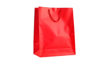 Bright red shopping bag standing upright against a simple background
