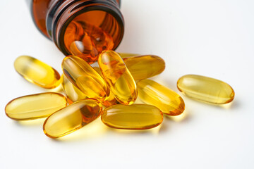 Vitamin capsules in a bottle, soft gels, Fish oil capsules, omega 3, omega 9, vitamin D, vitamin E