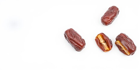 Obraz premium Fresh and ripe dates fruit with a shiny texture isolated on a white background, delicious, fruit