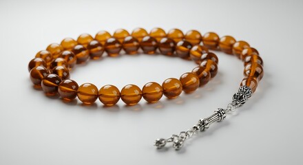 Brown beaded tasbih prayer beads with decorative silver elements