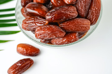Dates fruit tunisia, Tunisian honey dates, in bowl isolated on white background