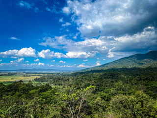 Fototapeta premium photo view of the beautiful rawa pening landscape with mountains, clear skies and green expanse