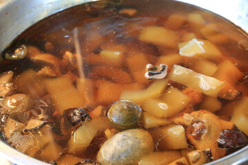 Pork bone soup with vegetable in big pot, Thai Food.