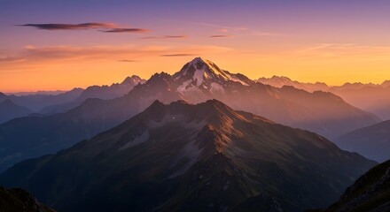 a sweeping panoramic view of mountains bathed in the early light of sunrise.