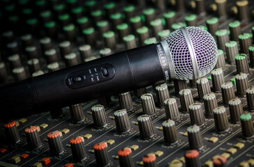 Close-up microphone and sound mixer in studio for sound record control