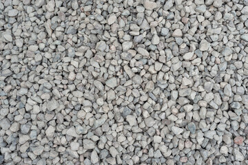 Obraz premium Close-Up of Natural Gravel Stones in a Uniform Background Pattern