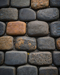 The walkway consists of both grey and brown stones.