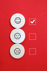 Emoticon smile on a yellow background Customer feedback