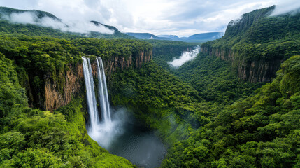 Fototapeta premium breathtaking waterfall cascading into deep jungle landscape