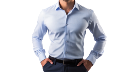 A confident man in a light blue button-up shirt stands with hands in pockets, exuding a professional demeanor in an elegant setting.