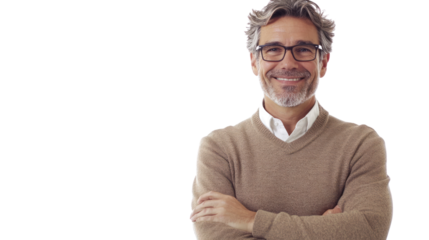A confident middle-aged man smiles warmly while standing with crossed arms, showcasing a professional yet approachable demeanor in a casual setting.