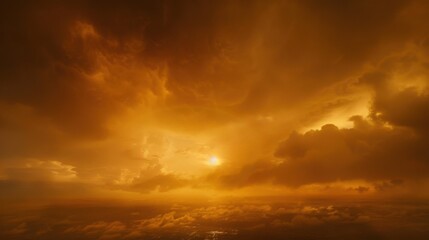 A breathtaking view of an orange-hued sky filled with clouds, capturing the beauty of a sunset or sunrise.