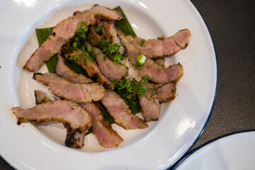Thai slice of juicy grilled beef. Thai food style for eating with Somtum. Thai grilled beef brisket