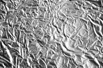 Crumpled silver plastic texture. Vintage scratched grunge background. Space for text.