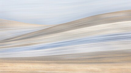Obraz premium A serene abstract landscape featuring soft, flowing lines in muted tones of beige, blue, and gray, evoking a sense of calm and tranquility.