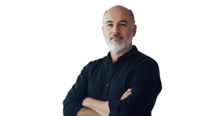 Confident middle-aged man with a beard standing with crossed arms, exuding professionalism and approachability in a modern office environment.