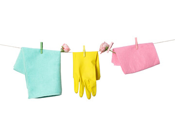 Spring cleaning, rags and cleaning gloves drying on a rope, isolated on white background, PNG
